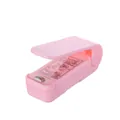 Pink portable mini heat sealer for snacks, handheld plastic bag sealer with safety guard - Chinese Packaging / Pink
