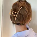 Elegant gold metal hair claw clip for bun styles shown on model's hair - Large Curved Claw Clip (79#)