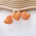 Hair claw clip with orange matte 3D hearts on a transparent base for stylish women - Orange Three Hearts Claw Clip (98#)