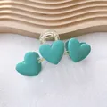 Matte green heart hair claw clip with gold spring on a wooden decorative tray - Green Three Hearts Claw Clip (99#)