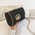 Classic black and gold tweed chain crossbody bag with metallic round twist lock and woven texture - Black