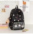 Detailed view of black student backpack featuring a transparent window with cute pins - Black (With Pendant)