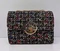 Classic multi-color tweed crossbody bag featuring gold chain and round twist lock - Iridescent Black