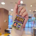 Golden mini casino slot machine keychain with 777 graphics and a movable handle - Modern Style / Gold