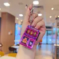 Mini electroplated purple slot machine keychain with a functional lever and metal ring - Modern Style / Pink