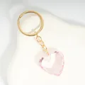 Sweet light pink acrylic heart-shaped crystal keychain with golden metal chain - Pink / Gold