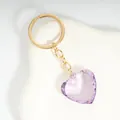 Purple faceted heart crystal keychain with golden metal chain on white stone - Light Purple / Gold