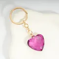 Sweet purple heart acrylic crystal keychain with gold alloy chain on a white wave stand - Deep purple / Gold