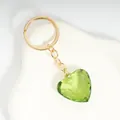 Green heart-shaped faceted crystal keychain with polished golden metal chain and ring - Dark Green / Gold