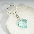 Light blue heart-shaped faceted crystal keychain with silver ring on white shell tray - Light Lake Blue / Silver