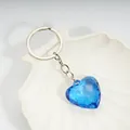 Blue faceted acrylic heart pendant keychain with a polished silver-tone four-link chain - Sapphire Blue / Silver