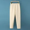 Pantalones térmicos acolchados beige para ancianos con cintura elástica en percha de madera - L / Pants