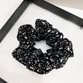 Detail of black velvet scrunchie featuring shimmering silver rhinestones and crystals - Fabric-wrapped Glass Rhinestone Style