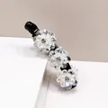 Pince à cheveux banane noire élégante avec trois fleurs en cristal et strass au centre - Blanc