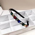 Detail of elegant black headband with multi-color K9 crystals in a white storage box - Colorful
