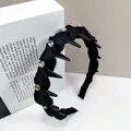 Detail of black twisted headband with large crystals and inner comb teeth for hair styling - Round Crystal Style / Black