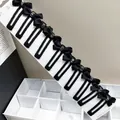 Set of ten black bow hair clips with crystal center on a long white display card - Rhinestone Strip Square Clip Bow