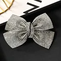 Pasador de pelo con lazo de cristal brillante y pedrería sobre base negra - Cruz 9.5cm Blanco