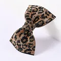 Macro detail of luxury leopard print bow hair clip with sparkling rhinestones decoration - Classic Leopard