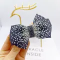 Elegante pasador de pelo con lazo y pedrería de cristales negros y blancos - Cruz Mediana Blanco y Negro