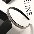 Detail of hand-set purple crystals and double-row zircons on a black headband - Light Pink