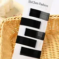 Set di 50 forcine in metallo nero per capelli su cartoncino bianco espositore - Stile Arco Piccolo / Nero