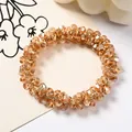 Beaded champagne crystal hair tie with multifaceted acrylic beads in a luxury finish - Crystal Loop (Transparent Coffee)