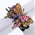 Pinza per capelli a farfalla colorata con strass viola e arancio su base nera - Diamanti colorati