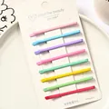 Set de 8 pinzas para el cabello de metal color macaron en tarjeta de papel blanco - Multicolor