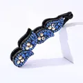 Detailed view of large banana hair clip with blue rhinestones and elegant wave pattern - Blue Rhinestone