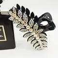 Luxurious black leaf-shaped hair claw clip with white rhinestones and a strong spring - White