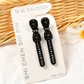 Par de horquillas negras con textura de diamante y pequeños detalles de cristal - Lazo Pequeño con Diamantes (NM-425) / Juego de 2 Piezas / Negro
