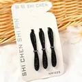 Juego de tres pinzas para el cabello con diamantes negros en tarjeta blanca - Estilo Lazo Grande (NM-425) / Juego de 3 / Negro