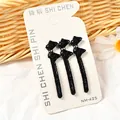Set de tres pinzas para el cabello con lazo negro y microcuentas en tarjeta de exhibición - Estilo Mariposa (NM-425) / Juego de 3 / Negro