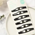 Set de seis pinzas para el cabello de metal negro mate en tarjeta de exhibición blanca - Pinzas Clic-Clac Mate / Juego de 6 / Negro