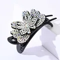 Detailed macro view of colorful rhinestones on double-layer butterfly hair claw clip - White Zircon