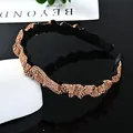 Diadema lujosa de terciopelo negro con cristales dorados y diseño ondulado brillante - Estilo Estrecho Strass Champaña Fruncido