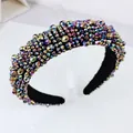 Baroque style wide headband featuring iridescent crystals and a black padded base - Rainbow