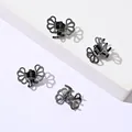 Set mit vier Mini-Haarklammern aus schwarzem Metall, Schmetterlingsform mit Hohlmuster - Dunkelgrau