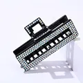 Detailed view of rectangular hair claw clip with colorful AB rhinestones on black base - Hollow Square AB Rhinestone