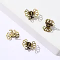 4er-Set Vintage-Schmetterling-Mini-Haarklammern mit Metallstruktur auf weißen Blöcken - Bronze