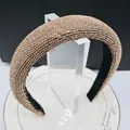 Elegant wide headband with champagne gold rhinestones and black fabric lining - Champagne