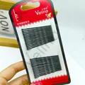 Set mit 24 schwarzen gewellten Haarklammern aus Metall auf zweifarbiger Kartonverpackung - Große Welle (Klein)