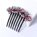 Elegante zwarte haarkam met drie vlinders voorzien van roze en iriserende strass-stenen - Vlinder Roze