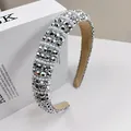 Macro detail of luxury sponge headband with sparkling rhinestones and white pearls - Silver