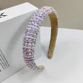 Detailed view of luxury padded headband with shimmering rhinestones and faux pearls - Pink