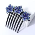 Elegante haarkam met 7 tanden en drie blauwe strass bloemen op zwarte harsbasis - Blauwe Bauhinia