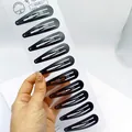 Set aus 10 mattschwarzen BB-Haarklammern aus Metall auf weißer Displaykarte - 6cm / Wassertropfenform Matt