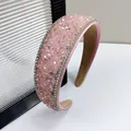 Close-up of pink crystal headband with sparkling rhinestones and soft suede inner lining - 4cm Wide / Pink