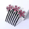 Elegante zwarte haarkam met drie roze strass bloemen en zeven stevige tanden - Bloemblad Bloem Roze